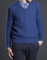 Blue V-neck sweater with cable stitch design 