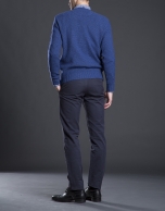 Blue V-neck sweater with cable stitch design 