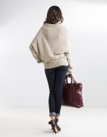 Long beige asymmetric sweater