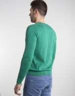 Green V-neck sweater