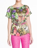 Loose green floral print silk blouse.