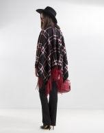 Red fringed poncho