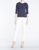 Navy blue boat neck sweater with gold buttons