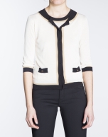 Beige sweater with black and beige trim 