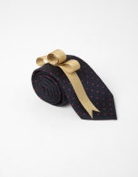 Navy blue tie with red dots