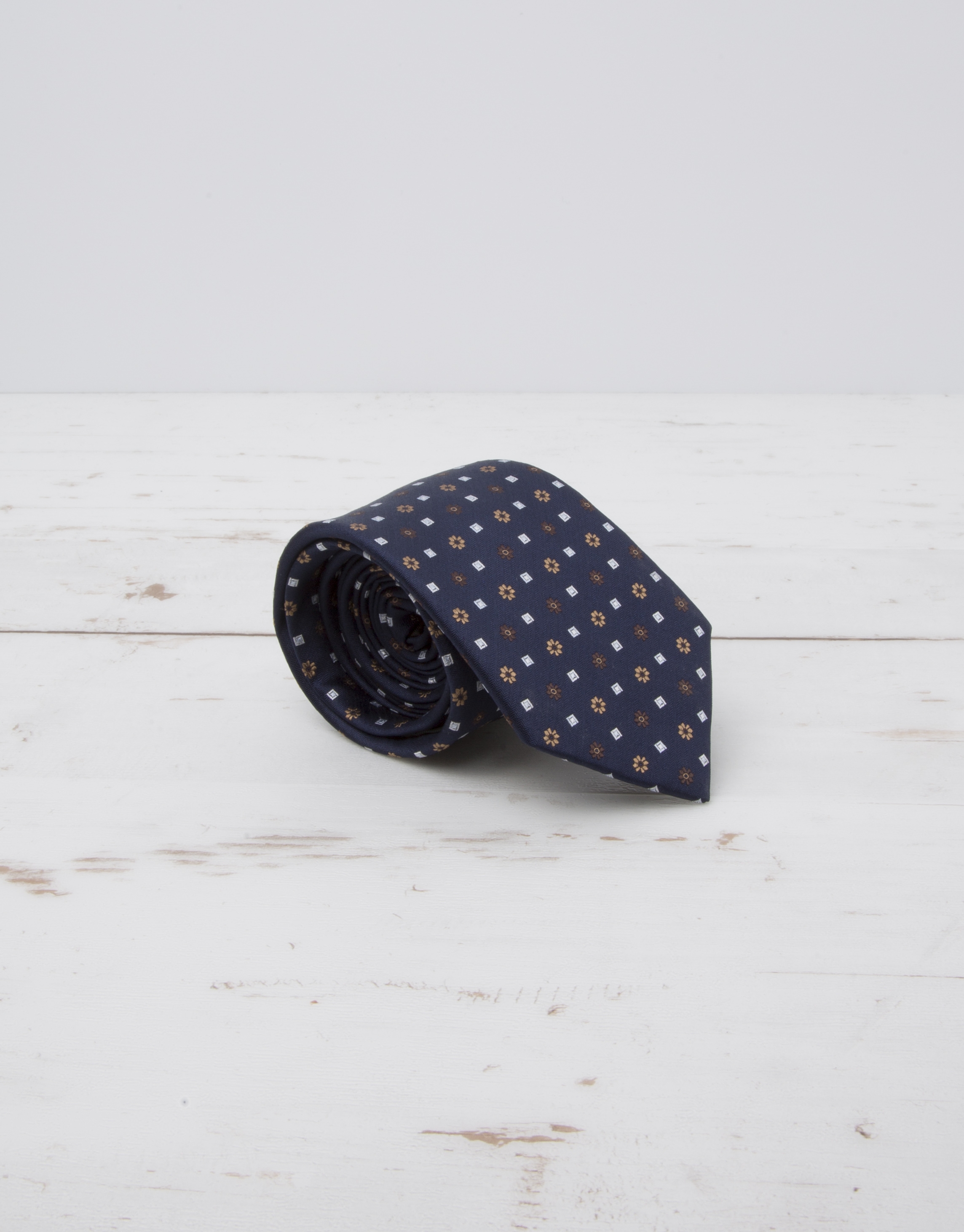 Navy blue tie with beige flowers