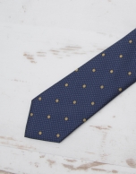 Navy blue tie with large yellow dots