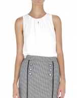 Ivory sleeveless top with tie at neck 