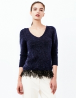 Blue sweater with feathers