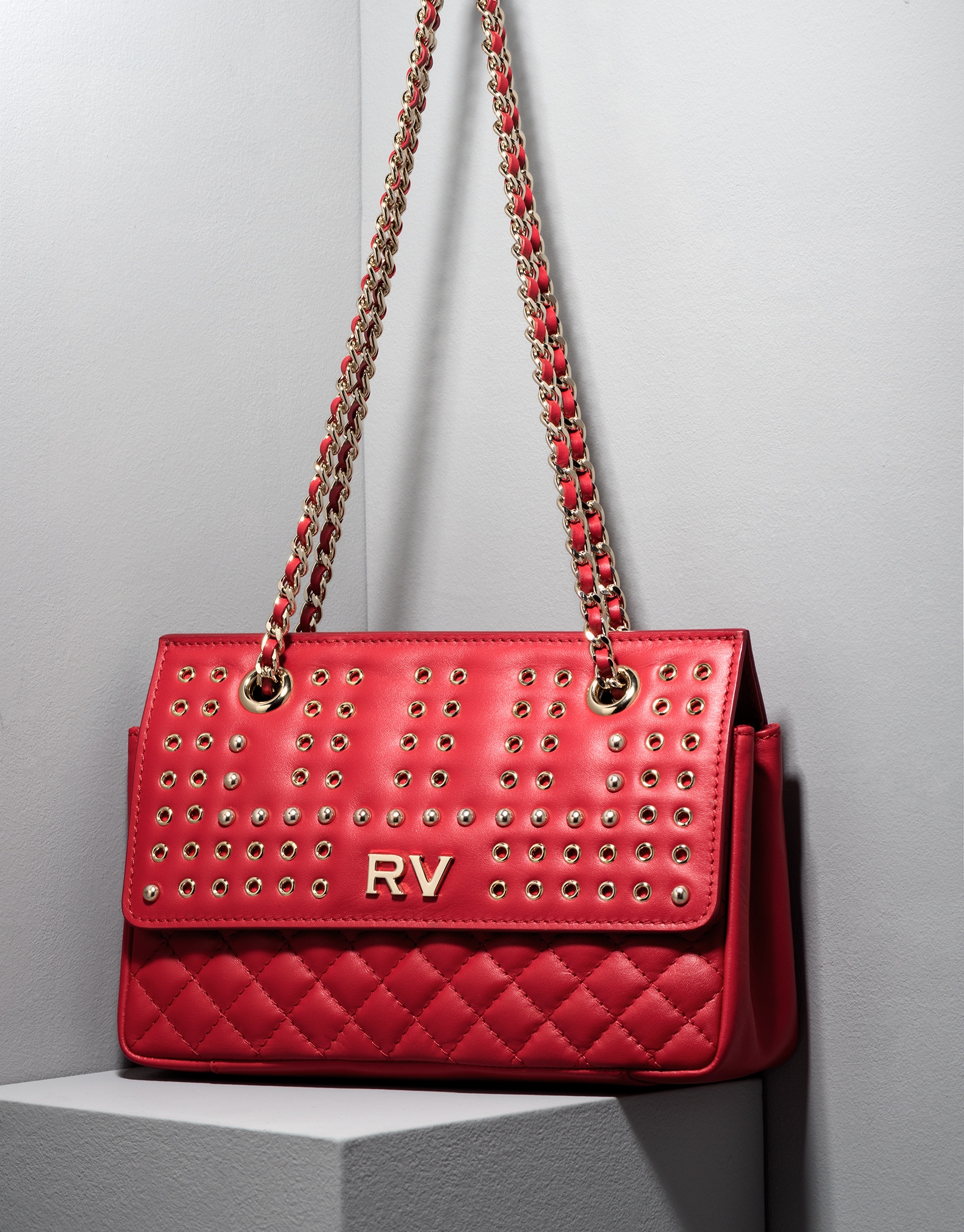 Red Ghauri bag with metallic appliqué