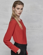 Red blouse with tucks