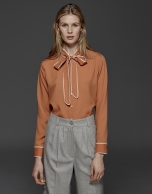 Orange shirt with bow collar