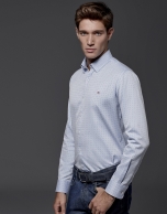 Light blue shirt with red dots