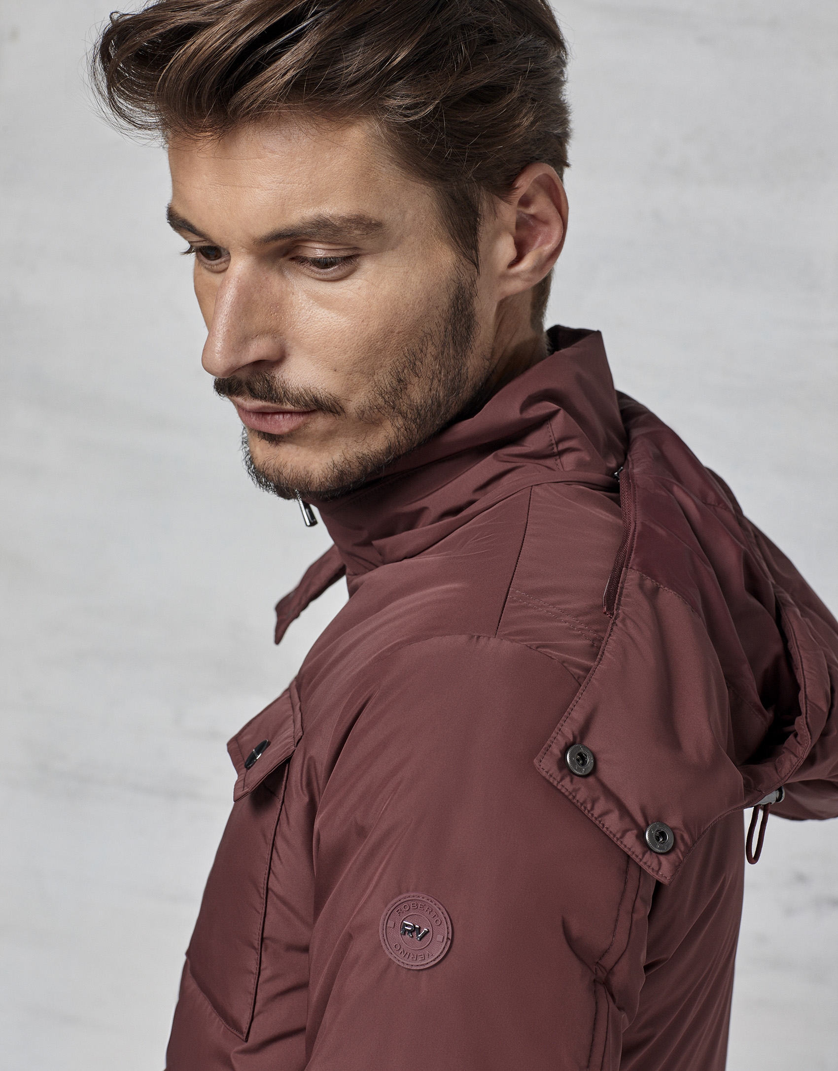 Maroon windbreaker with hood and fur collar