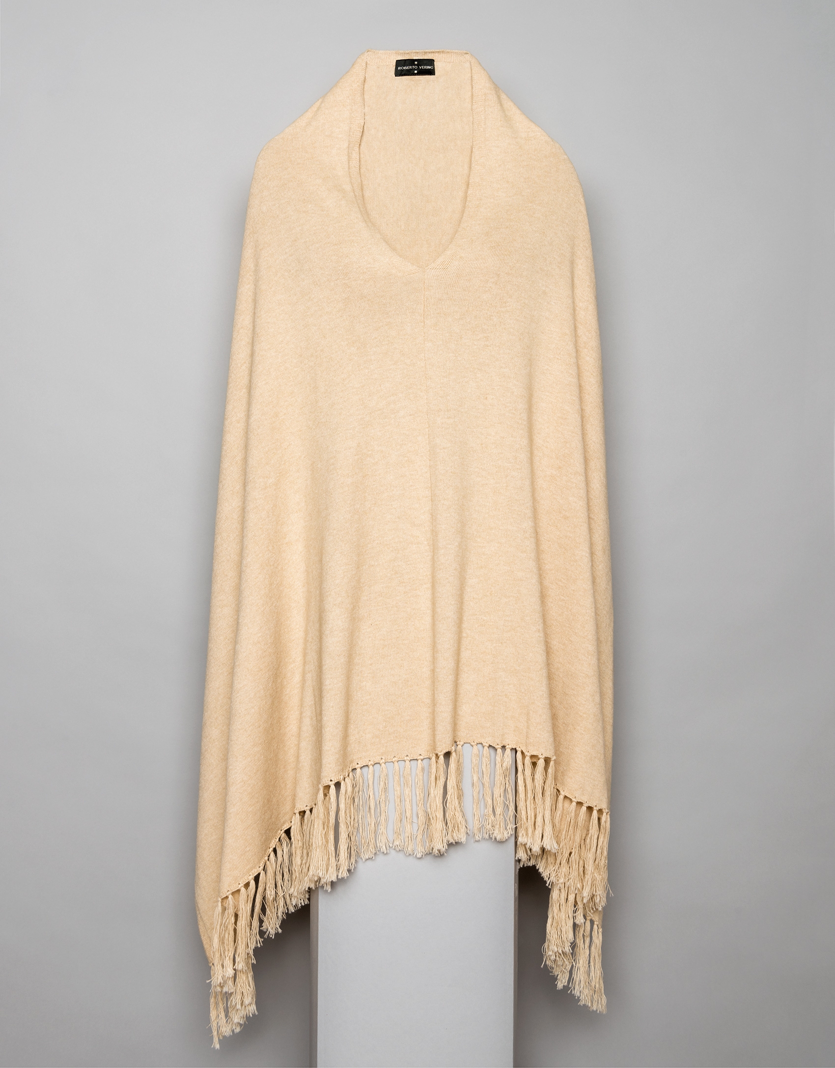 Beige cape with fringe