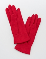 Red knit gloves with tassel