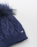 Blue cable knit wool cap with pompom