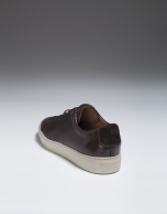 Brown leather sneakers with perforated sides