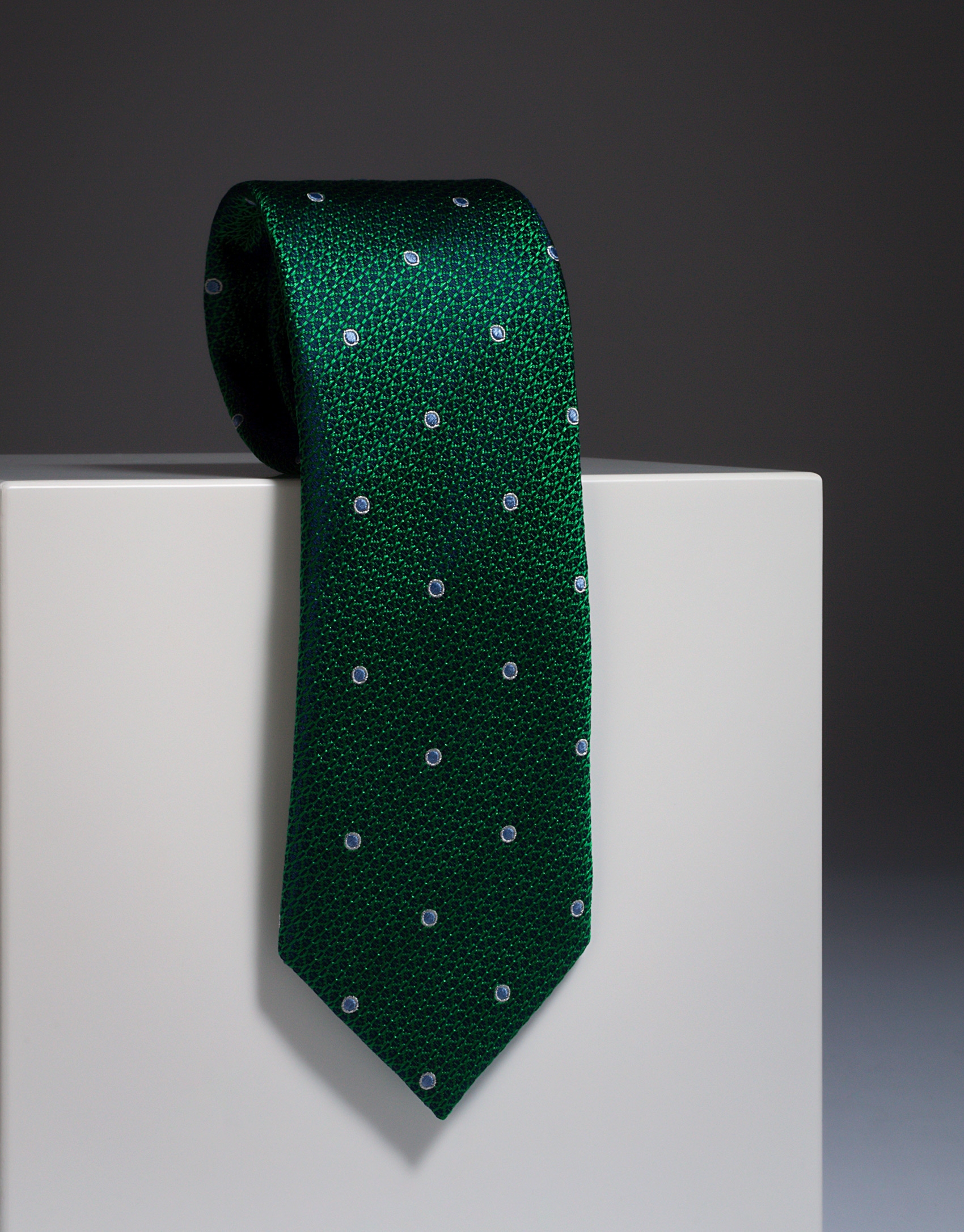 Green silk tie with large ivory dots