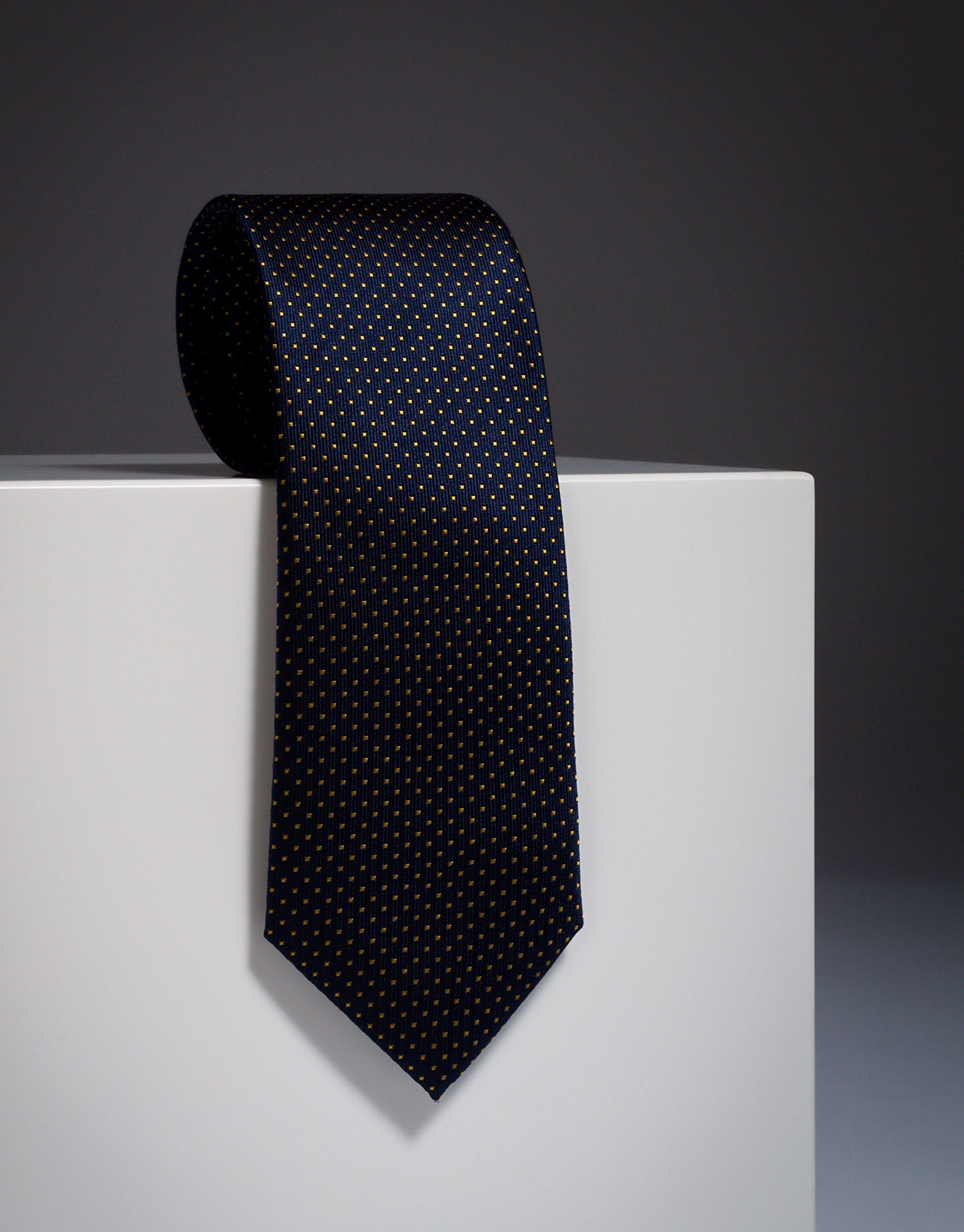 Navy blue silk tie with yellow microdots