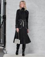 Black trench coat with white stitching