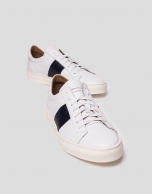 White sports shoes with side panels