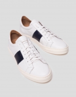 White sports shoes with side panels