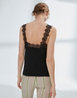 Black top with lace appliqué 