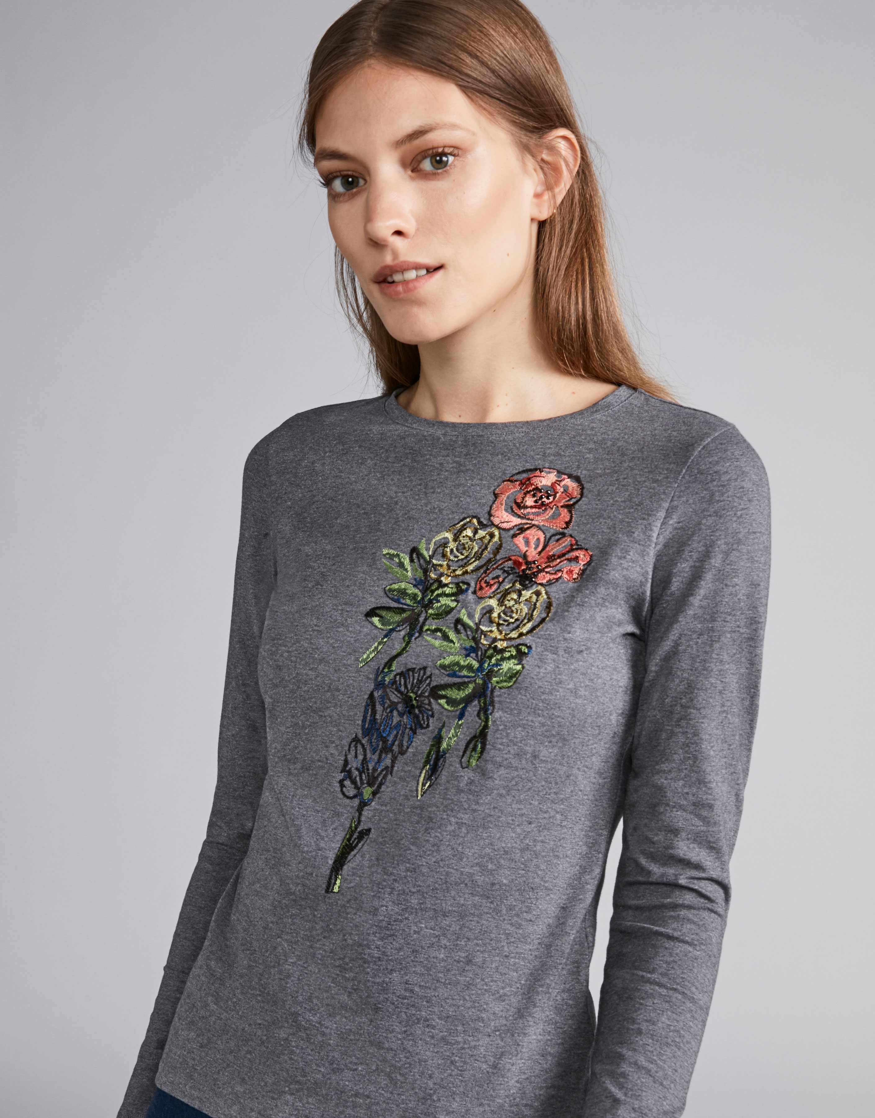 Steel-colored top with floral embroidered print