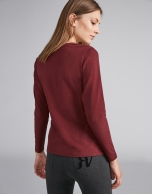 Burgundy V-neck top with embroidered flower