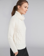 White sweater with stovepipe collar and decoration