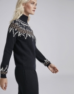 Navy blue sweater with fretted print