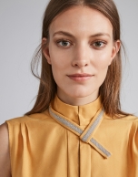 Gold-colored top with decorative collar