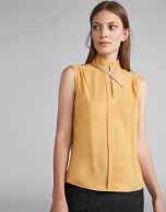 Gold-colored top with decorative collar