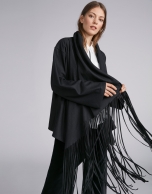 Black cape-effect jacket with fringe