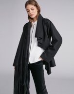 Black cape-effect jacket with fringe