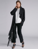 Black cape-effect jacket with fringe