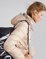 Beige quilted ski jacket with belt