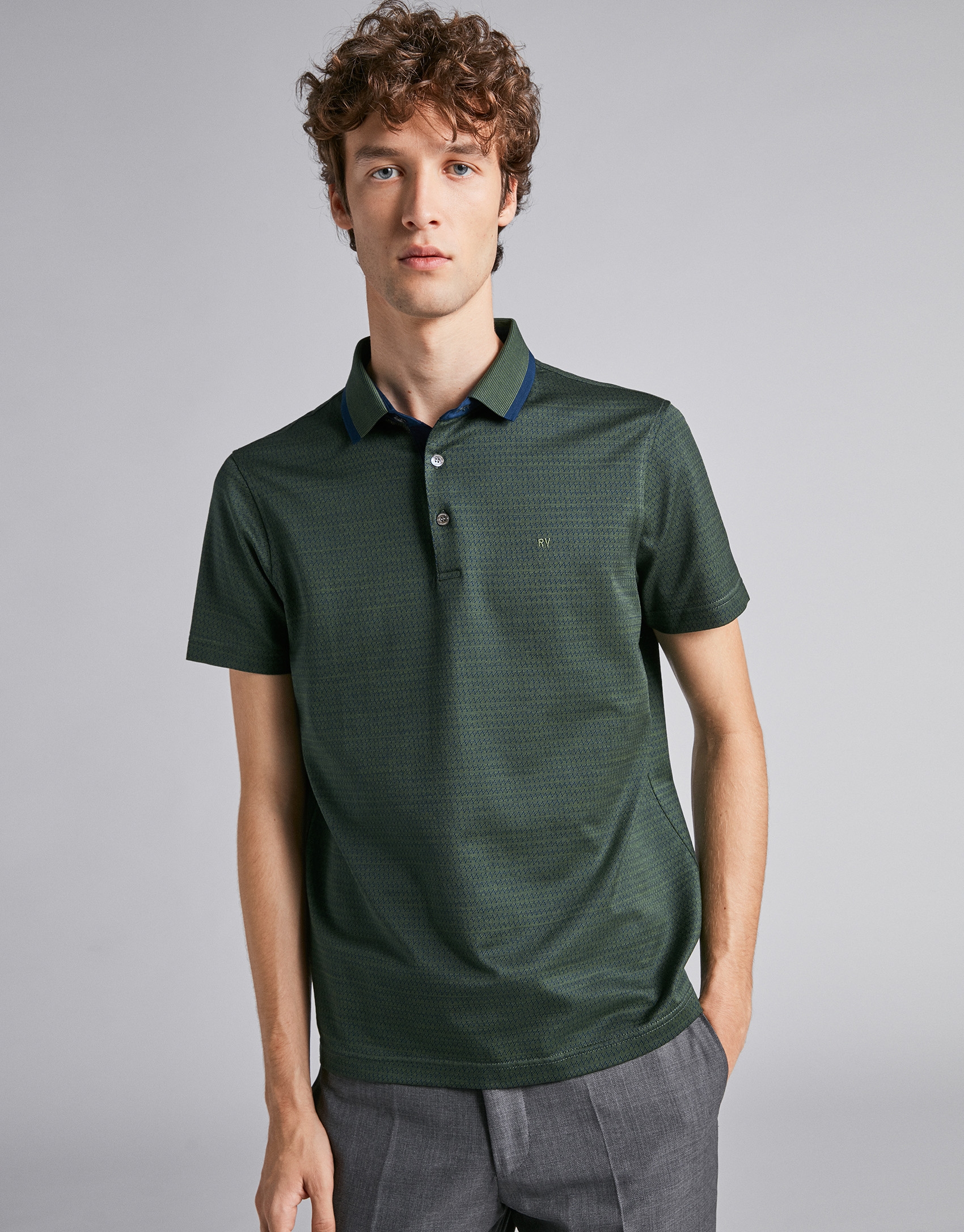 Polo jacquard en tonos verde/azul oscuro y cuello mil rayas