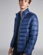 Blue tech ski jacket with details on zippers