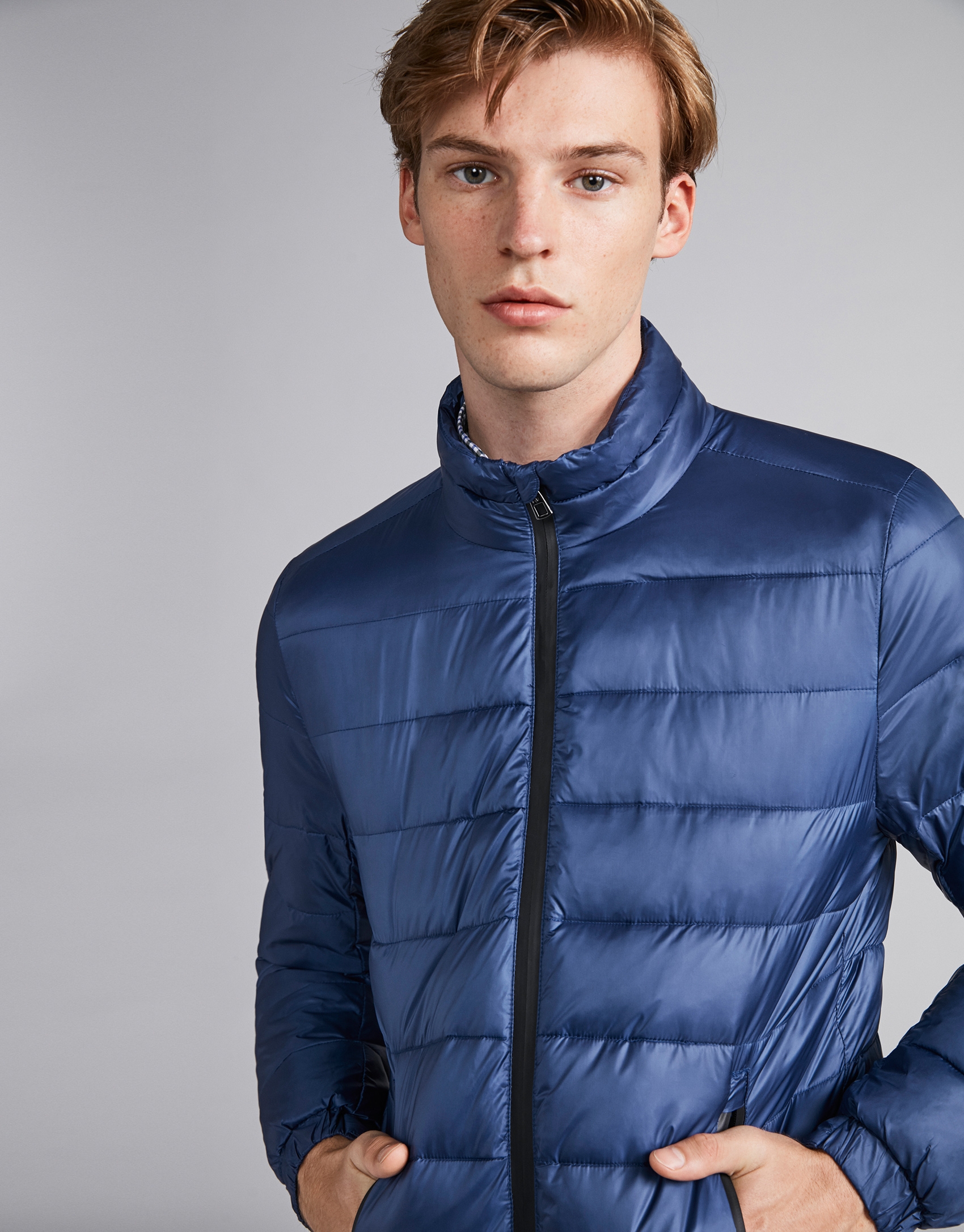 Blue tech ski jacket with details on zippers