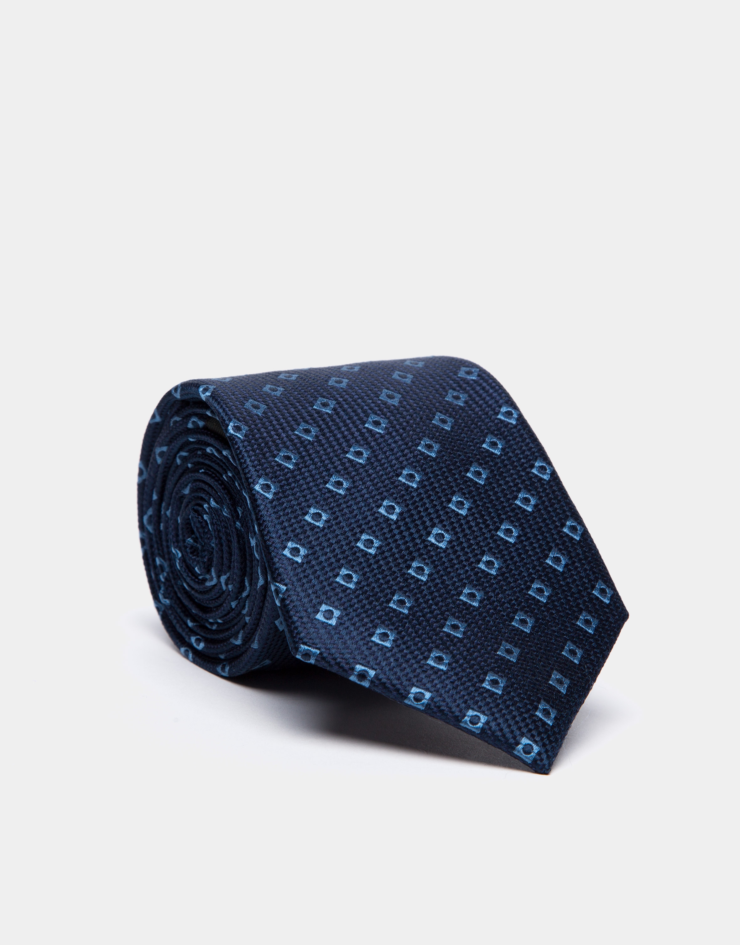 Corbata de seda azul oscuro con jacquard geométrico celeste