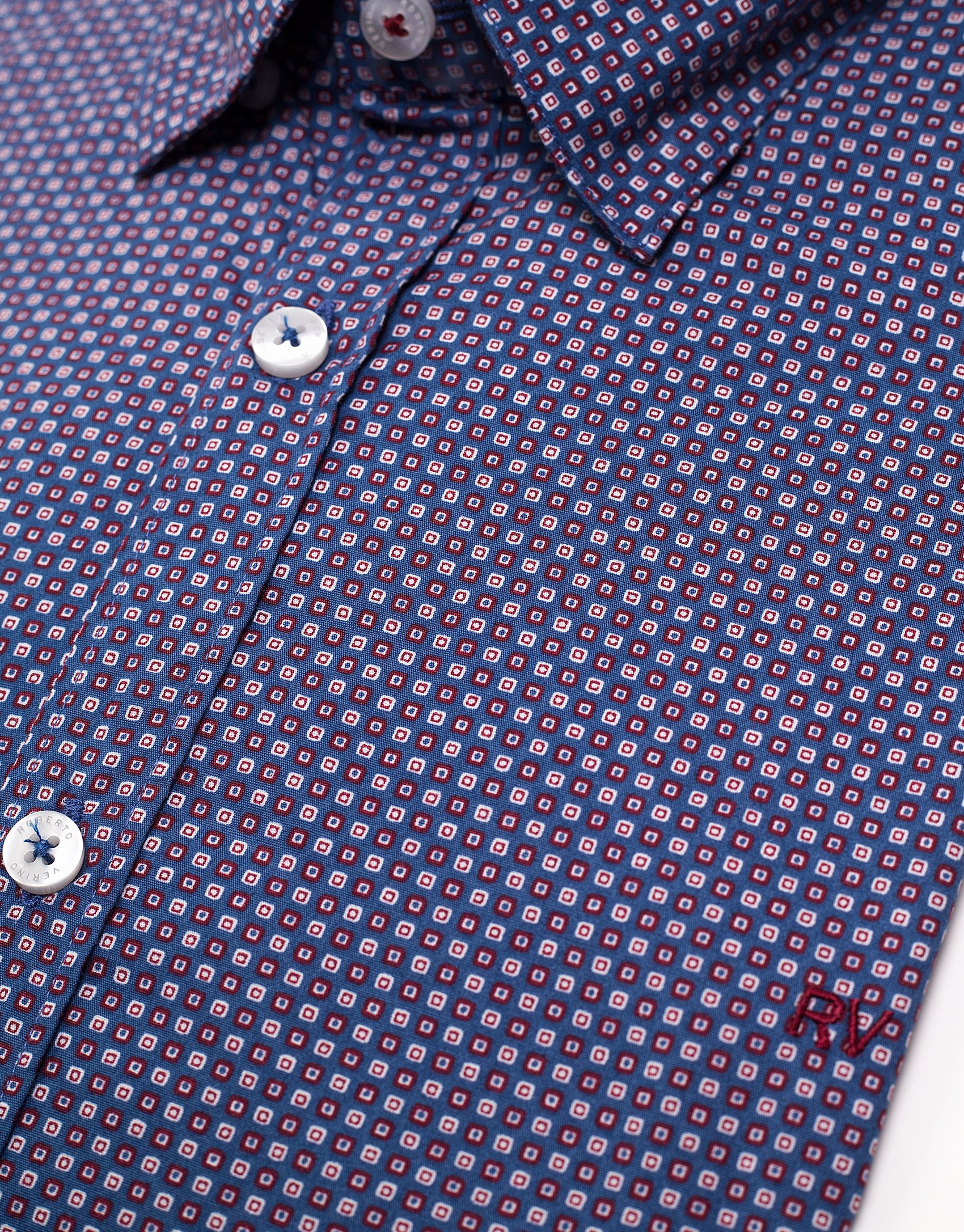 Blue sport shirt with red geometric print