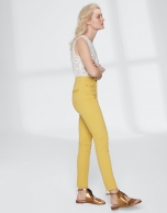 Yellow pants with fringe hem