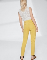 Yellow pants with fringe hem