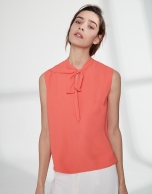 Orange top with bow