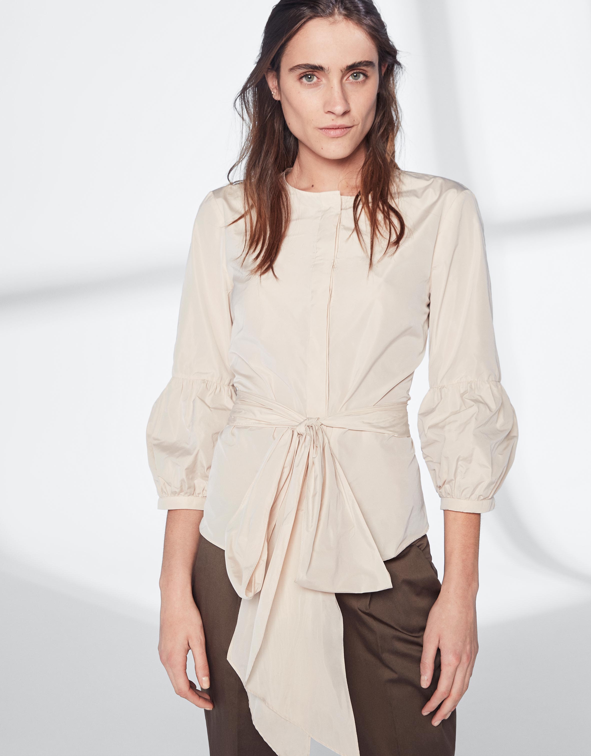 Sandy-colored top with gathered sleeves