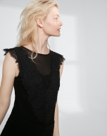 Black top with transparencies and lace