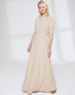 Long, draping, sandy-colored dress 