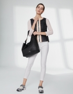 Black quilted vest with contrasting beige